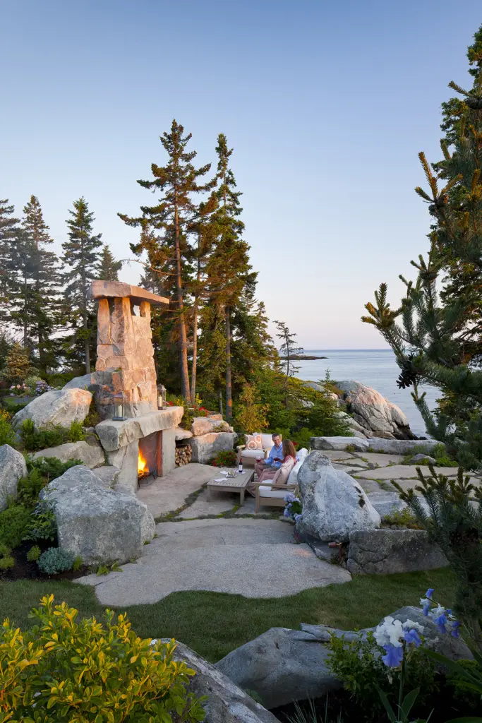 View of outdoor fireplace from garden