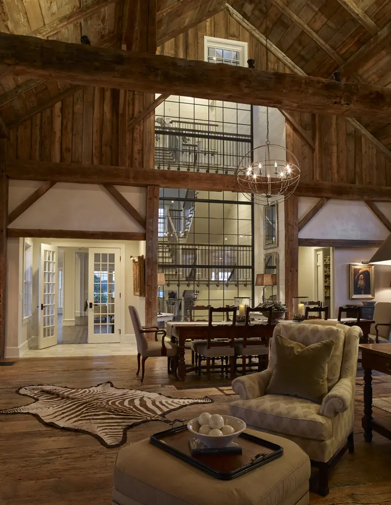 View from the spacious living room back towards the glass wall and the staircase beyond