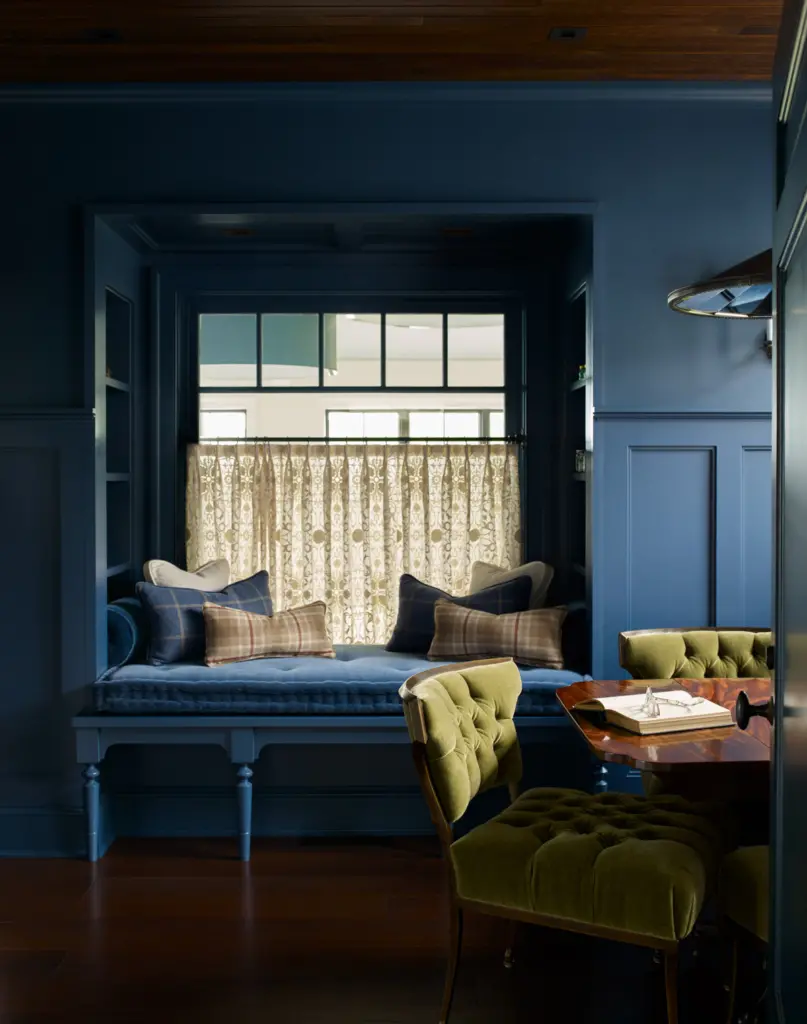 A navy and plaid themed nook within the library.