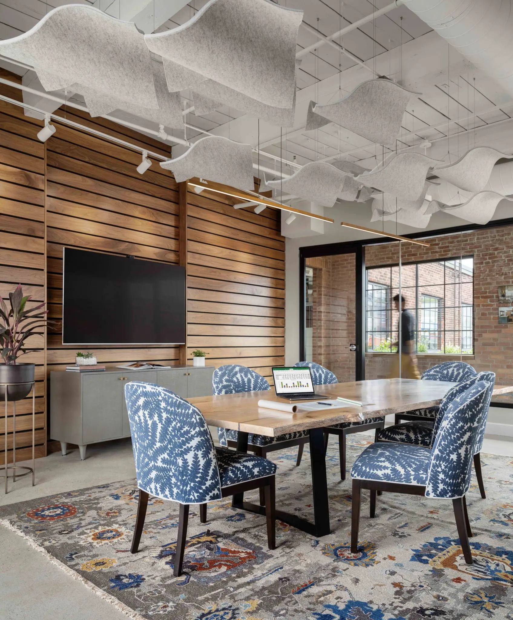 Conference room with custom live edge table, wool felt installation